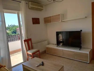 Una televisión o centro de entretenimiento en Apartamento La Relojera 1