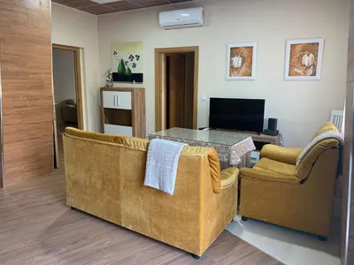 Una televisión o centro de entretenimiento en Apartamentos La Unión
