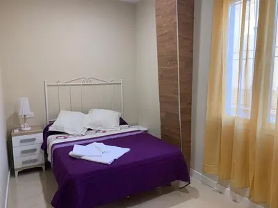 Cama o camas de una habitación en Apartamentos La Unión