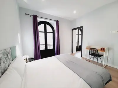 Cama o camas de una habitación en Apartamentos Vega by gaiarooms