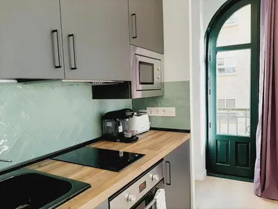 Una cocina o zona de cocina en Apartamentos Vega by gaiarooms