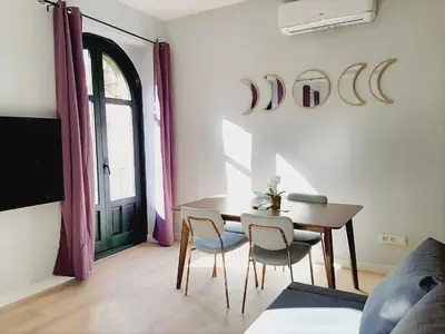 Zona de estar de Apartamentos Vega by gaiarooms