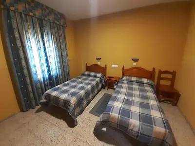 Cama o camas de una habitación en Hotel Nuevo Lorenzo