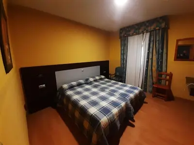 Cama o camas de una habitación en Hotel Nuevo Lorenzo