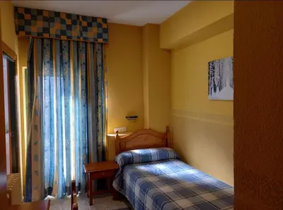 Cama o camas de una habitación en Hotel Nuevo Lorenzo