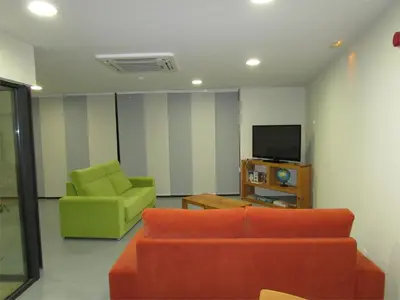 Una televisión o centro de entretenimiento en Posada Real El Brasilero