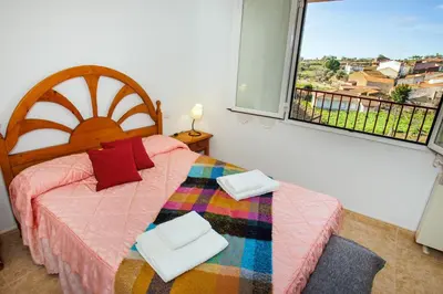 Cama o camas de una habitación en EL HOGAR DEL HERRERO