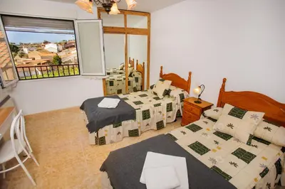 Cama o camas de una habitación en EL HOGAR DEL HERRERO