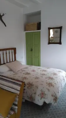 Cama o camas de una habitación en Apartamentos bioclimáticos El Mirlo Azul