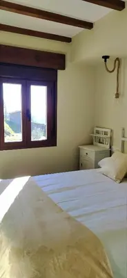 Cama o camas de una habitación en Apartamentos La Rosa y El Pastor