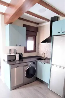 Una cocina o zona de cocina en Apartamentos La Rosa y El Pastor