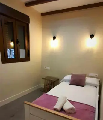 Cama o camas de una habitación en Apartamentos La Rosa y El Pastor