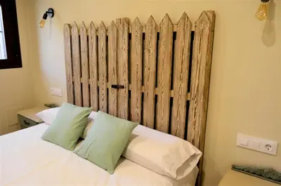 Cama o camas de una habitación en Apartamentos La Rosa y El Pastor