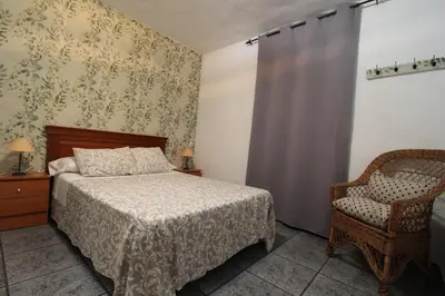 Cama o camas de una habitación en Casa rural Victoria