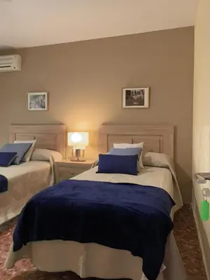 Cama o camas de una habitación en CERES Home Parking Gratis