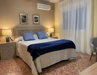 Cama o camas de una habitación en CERES Home Parking Gratis