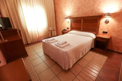 Cama o camas de una habitación en Hospedium Hotel Doña Mafalda de Castilla