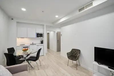 Una televisión o centro de entretenimiento en Inés Luna Suites