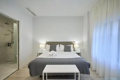 Cama o camas de una habitación en Inés Luna Suites