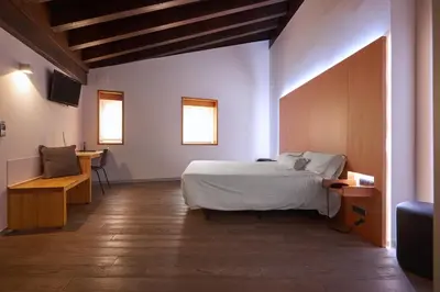 Cama o camas de una habitación en María Pacheco Hotel Boutique