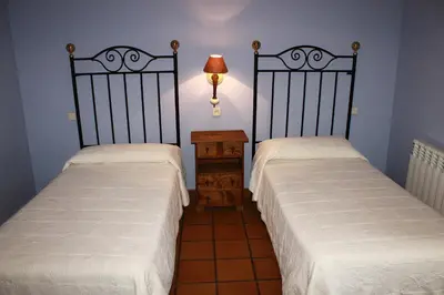 Cama o camas de una habitación en La Casa de la Abuela