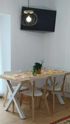 Una televisión o centro de entretenimiento en Casa Iulia Emérita Parking Gratis