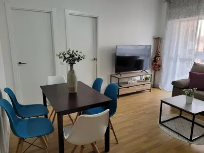 Una televisión o centro de entretenimiento en Piso Stylety Alcazar