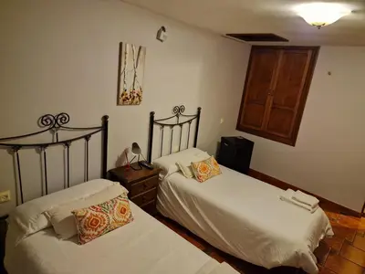 Cama o camas de una habitación en Casa Cofrades