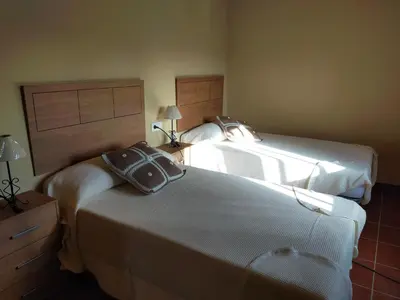 Cama o camas de una habitación en Complejo Rural La Paloma