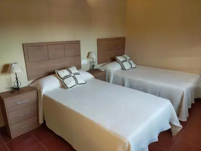 Cama o camas de una habitación en Complejo Rural La Paloma