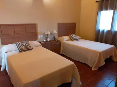 Cama o camas de una habitación en Complejo Rural La Paloma