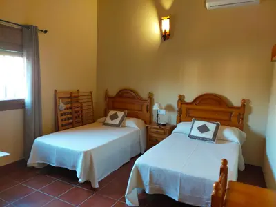 Cama o camas de una habitación en Complejo Rural La Paloma