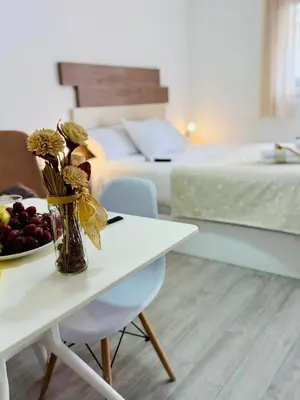 Cama o camas de una habitación en ALAUDAE Apartamentos Parking Gratis