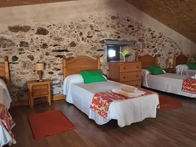 Cama o camas de una habitación en El Almendro del Cura