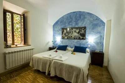 Cama o camas de una habitación en La Posada de Grimaldo
