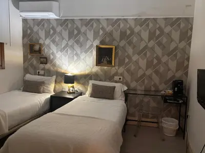Cama o camas de una habitación en Santa Rita Rita B&Boutique