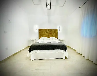 Cama o camas de una habitación en Apartamentos Guaditania