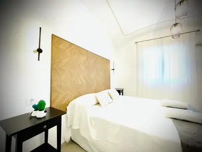 Cama o camas de una habitación en Apartamentos Guaditania
