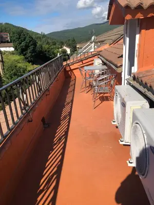 Un balcón o terraza de APARTAMENTO TURISTICO ATICO LA TABERNA