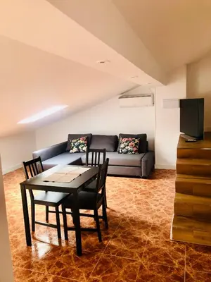 Zona de estar de APARTAMENTO TURISTICO ATICO LA TABERNA