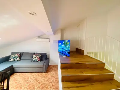 Zona de estar de APARTAMENTO TURISTICO ATICO LA TABERNA