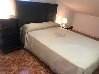 Cama o camas de una habitación en APARTAMENTO TURISTICO ATICO LA TABERNA