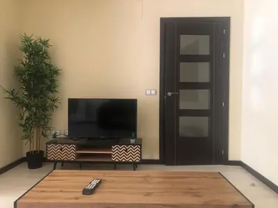 Una televisión o centro de entretenimiento en Apartamento MIRABOSQUE - plaza garaje incluida