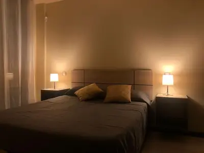 Cama o camas de una habitación en Apartamento MIRABOSQUE - plaza garaje incluida