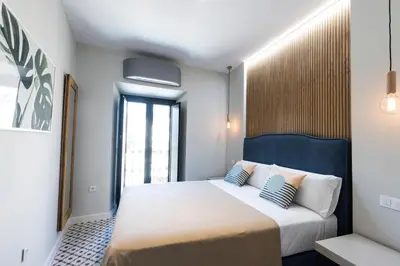 Cama o camas de una habitación en Apartamentos El Patio, Plaza Mayor Trujillo