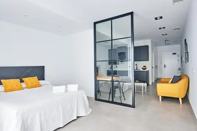 Cama o camas de una habitación en 9 NIDOS Céntrica Suites - Nuevo