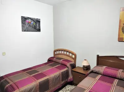 Cama o camas de una habitación en Casa Rural EL HUERTO con Jardín