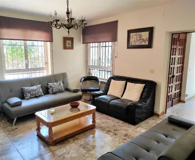 Zona de estar de Casa Rural EL HUERTO con Jardín