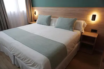 Cama o camas de una habitación en Hotel Don Pepo