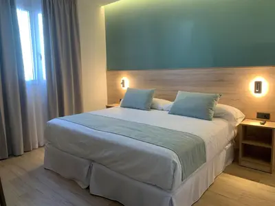 Cama o camas de una habitación en Hotel Don Pepo